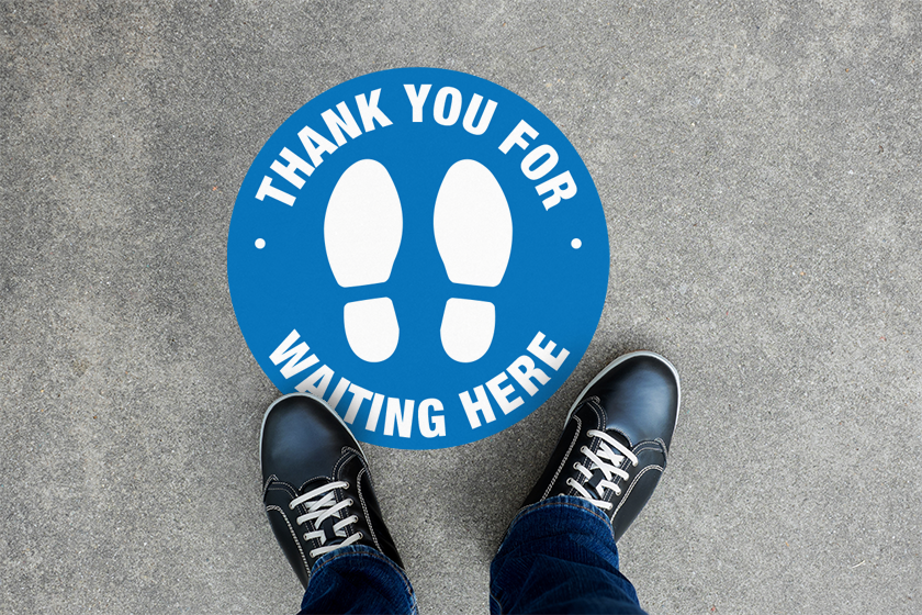 Social distancing floor decals for a store