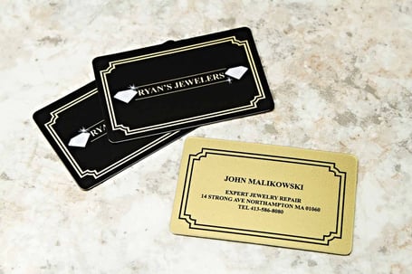 Example of metallic business cards printed for Ryan's Jewelers by Plastic Printers.com