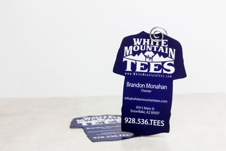 Creative die cut business cards shaped like a t shirt for White Mountain Tees