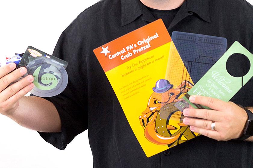 Unique Corporate Marketing tools like wine charms, coasters, door hangers, menus, key tags and more.