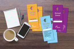 Custom door hangers with a writable surface