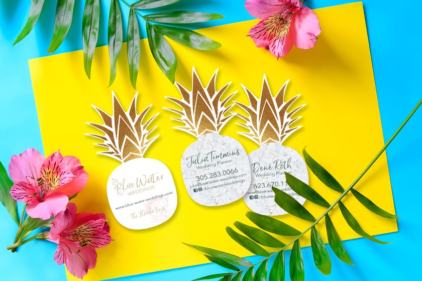Custom shaped business cards in the shape of a pineapple for a wedding planner