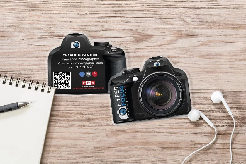 Die cut business cards in the shape of a camera 