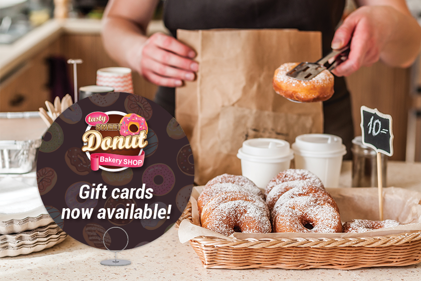 Custom signage advertising your gift cards is an important step in how to sell more gift cards