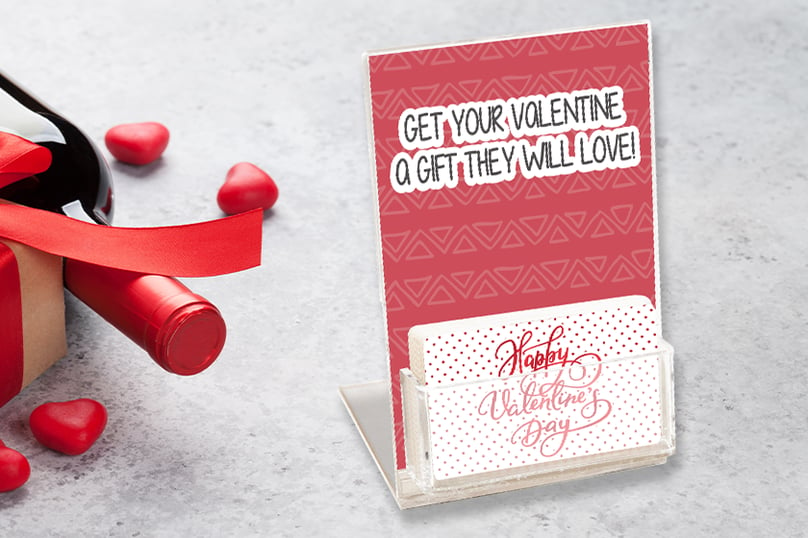 Custom gift cards in a display stand designed for Valentine's Day